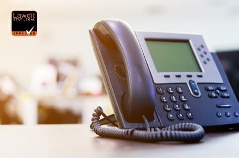 Office telephone with a "Stay Legal" approved logo, symbolizing legal expertise and communication for UK businesses seeking advice on defamation and legal disputes.