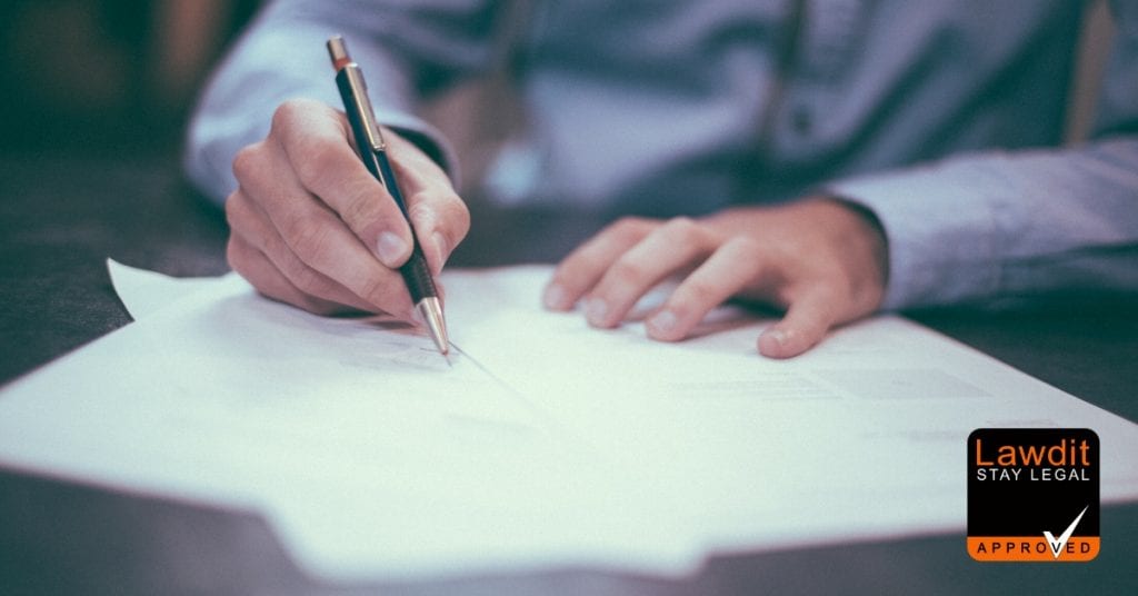 picture of a man writing a contract